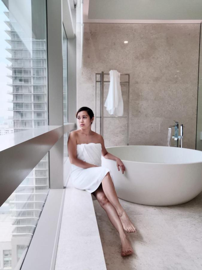 Ph Suites At Pavilion Bukit Bintang 쿠알라룸푸르 외부 사진 A woman wrapped in a bath sheet